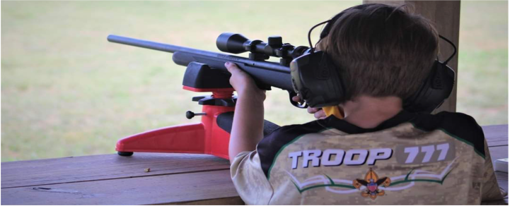 Scout with CP and vision impairment using a rifle
