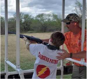 Scout with CP and vision impairment using a shotgun